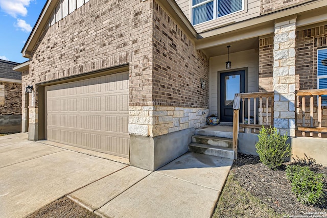 view of exterior entry with brick siding, board and batten siding, and concrete driveway
