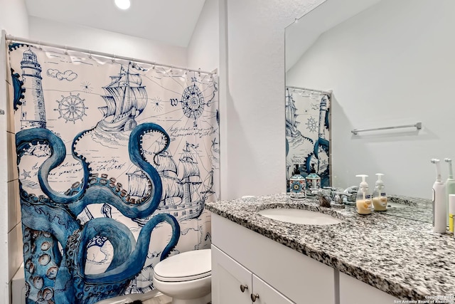 bathroom with toilet, curtained shower, and vanity