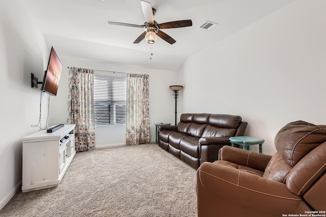 living area with a ceiling fan, baseboards, visible vents, and light carpet
