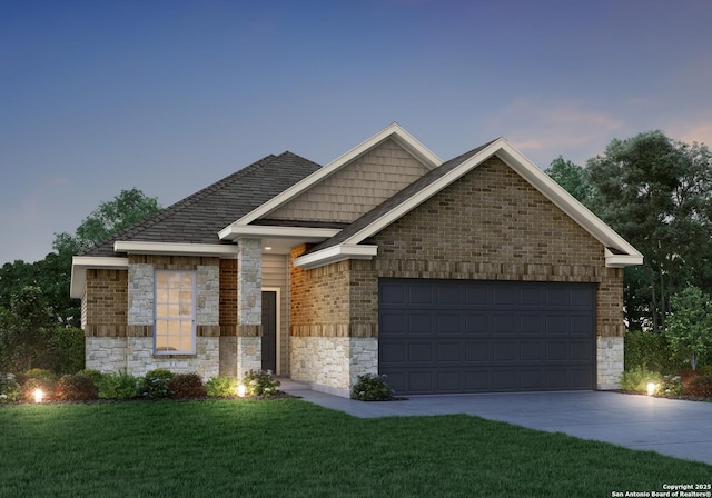 single story home with driveway, a front yard, a garage, brick siding, and stone siding
