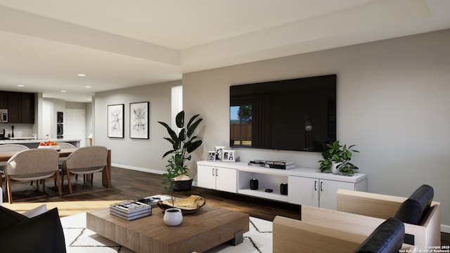 living area with baseboards, recessed lighting, and wood finished floors