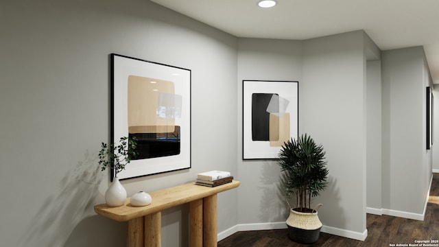 corridor with recessed lighting, baseboards, and dark wood finished floors