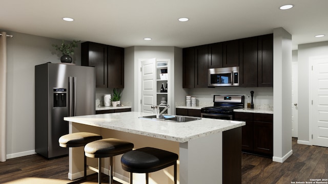 140 Duck Trl, San Antonio, TX 78245 - kitchen with dark wood-type flooring, recessed lighting, light stone counters, a sink, and stainless steel appliances
