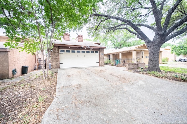 6405 Honey Hill, San Antonio, TX 78229 - ranch-style house with brick siding, a garage, a chimney, and concrete driveway