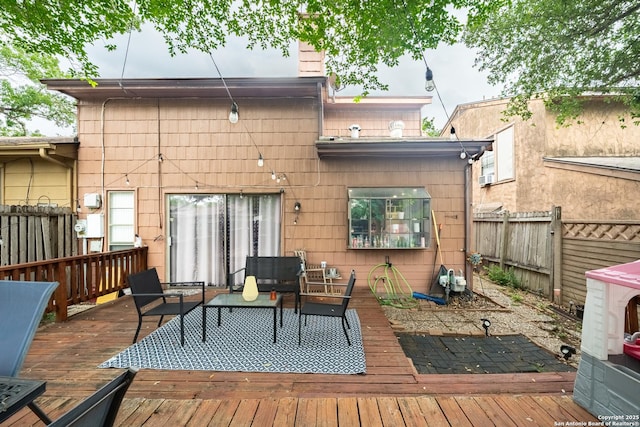 6405 Honey Hill, San Antonio, TX 78229 - back of property with a fenced backyard, a wooden deck, an outdoor hangout area, and a chimney