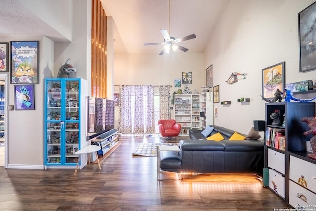 6405 Honey Hill, San Antonio, TX 78229 - living room featuring a ceiling fan, a high ceiling, and wood finished floors