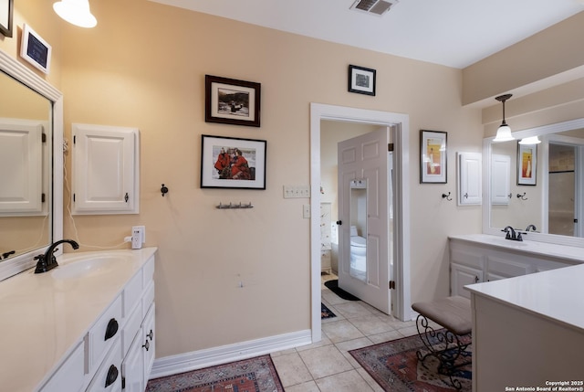 bathroom featuring visible vents, tile patterned flooring, toilet, and vanity