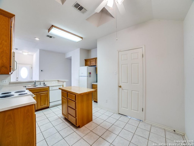 kitchen with light countertops, visible vents, ceiling fan, and white appliances