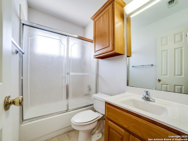full bathroom with toilet, vanity, visible vents, tile patterned flooring, and combined bath / shower with glass door