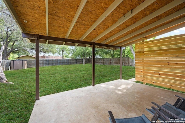 7722 Strolling Ln, Live Oak, TX 78233 - view of patio with an outdoor structure, a fenced backyard, and a storage shed