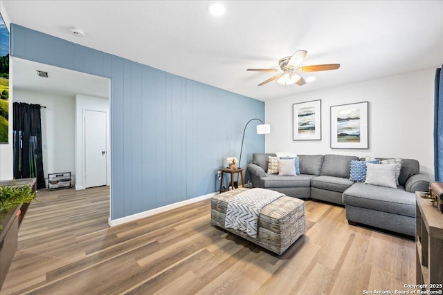 7722 Strolling Ln, Live Oak, TX 78233 - living room with visible vents, light wood-style flooring, ceiling fan, and baseboards
