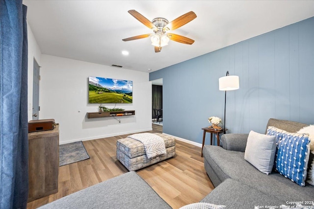 7722 Strolling Ln, Live Oak, TX 78233 - living room with baseboards, a ceiling fan, wood finished floors, and visible vents