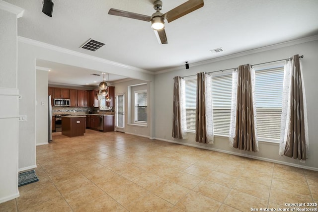 unfurnished living room with ceiling fan, visible vents, light tile patterned floors, baseboards, and ornamental molding