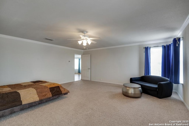 unfurnished bedroom with carpet floors, baseboards, crown molding, and visible vents