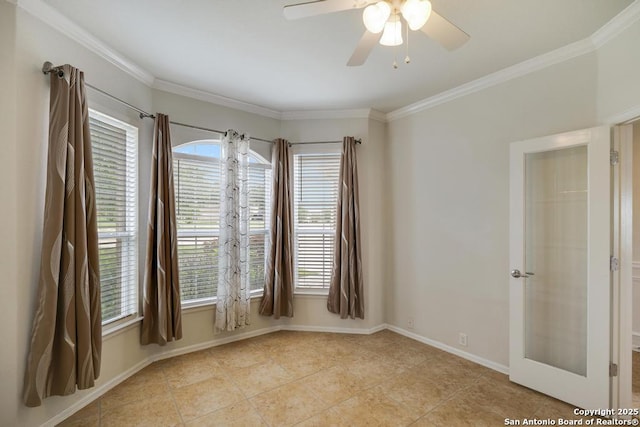 unfurnished room with crown molding, a wealth of natural light, and light tile patterned floors