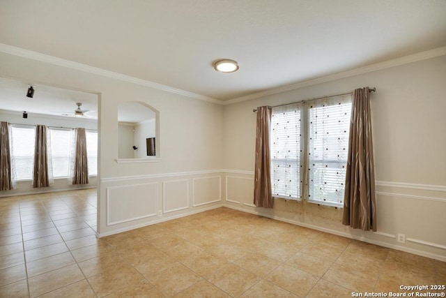 unfurnished room featuring ornamental molding, ceiling fan, and light tile patterned floors
