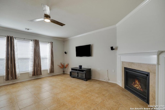 unfurnished living room with ceiling fan, visible vents, crown molding, a tile fireplace, and light tile patterned flooring