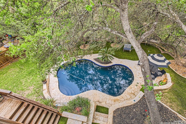 pool featuring a patio and fence private yard