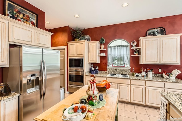 kitchen featuring light tile patterned flooring, open shelves, appliances with stainless steel finishes, light brown cabinets, and recessed lighting