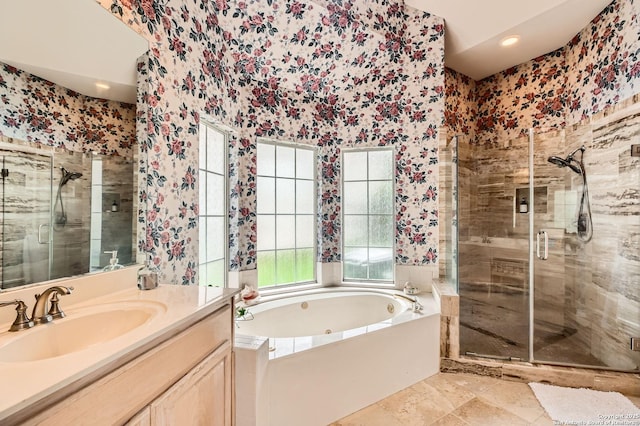full bathroom with vanity, a bath, a stall shower, and wallpapered walls