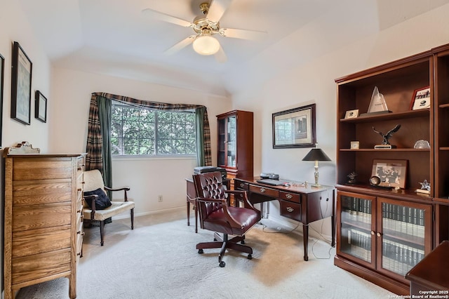 office area featuring light colored carpet, a ceiling fan, and baseboards
