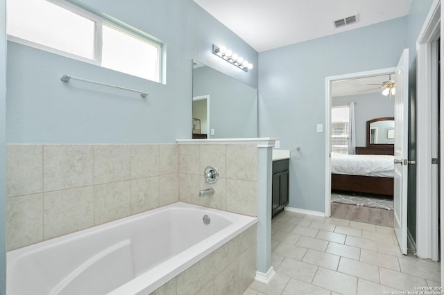 full bath featuring a healthy amount of sunlight, vanity, ensuite bathroom, and visible vents