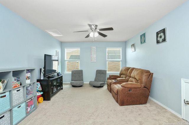 interior space featuring carpet flooring, a ceiling fan, and baseboards