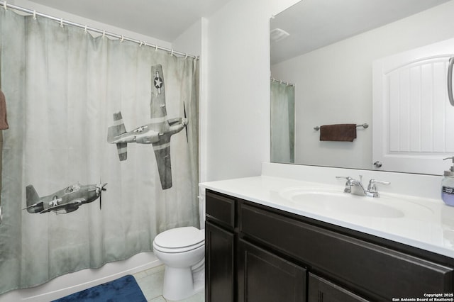 bathroom with tile patterned flooring, toilet, and vanity