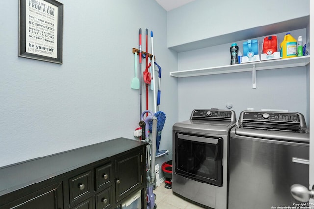 606 Sage Thrasher, San Antonio, TX 78253 - clothes washing area with cabinet space, light tile patterned flooring, and washer and clothes dryer
