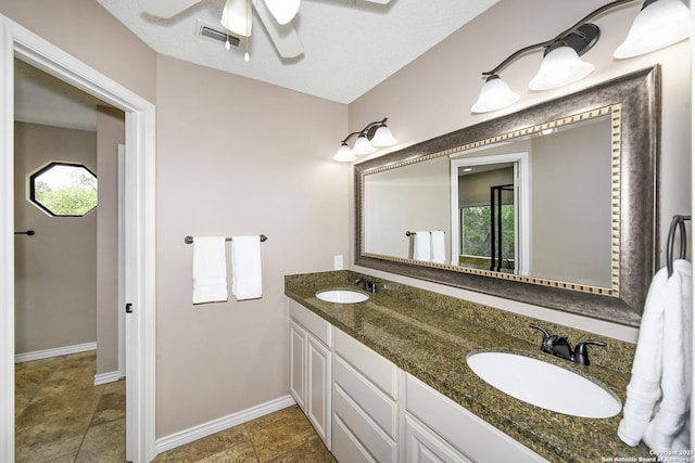 2928 Hidden Elm, San Antonio, TX 78261 - full bathroom with baseboards, ceiling fan, a healthy amount of sunlight, and a sink
