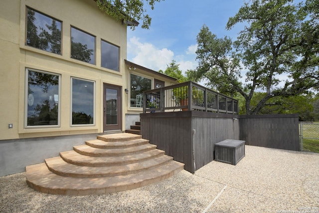2928 Hidden Elm, San Antonio, TX 78261 - view of side of property featuring fence, stucco siding, a patio area, and a deck