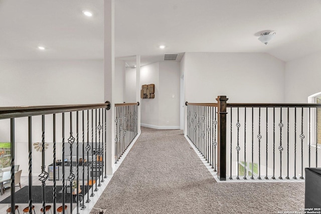 hallway featuring visible vents, recessed lighting, carpet, and baseboards