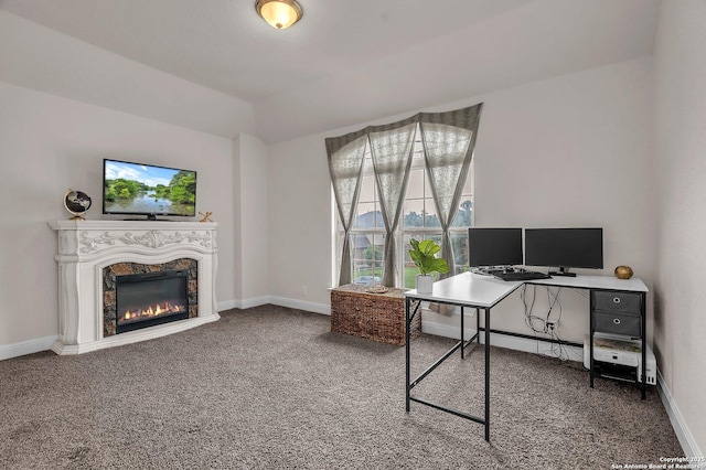 carpeted home office featuring baseboards and a premium fireplace