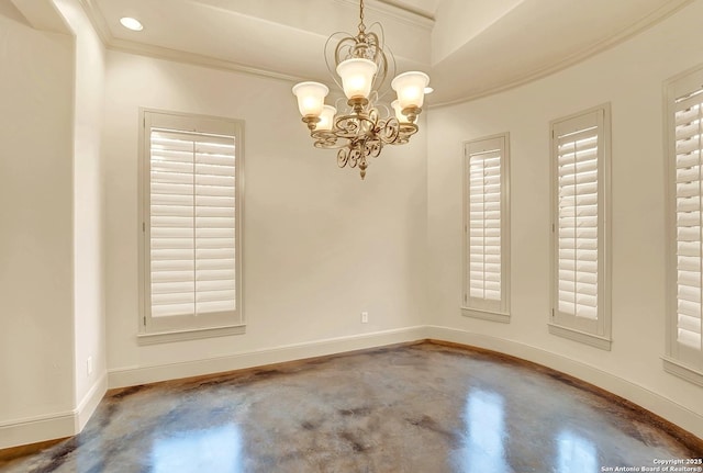 spare room with crown molding, baseboards, concrete flooring, and a notable chandelier