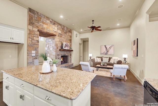 kitchen with light stone counters, ceiling fan, finished concrete floors, and dishwasher