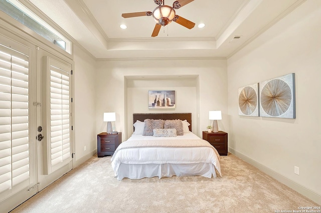 bedroom with recessed lighting, light colored carpet, ornamental molding, and a raised ceiling