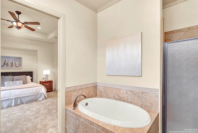 full bath with ensuite bath, a ceiling fan, a shower stall, ornamental molding, and a bath