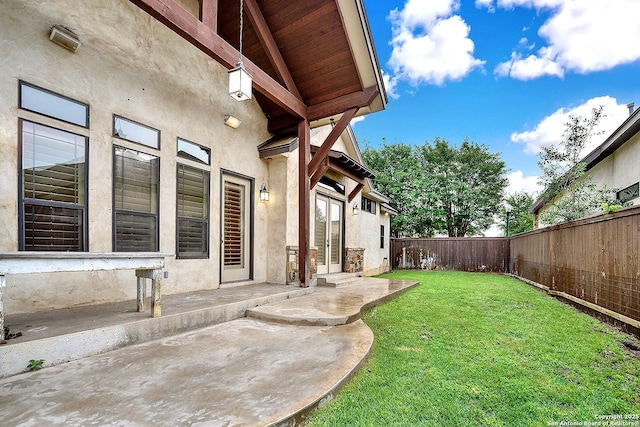 view of yard featuring a fenced backyard and a patio area