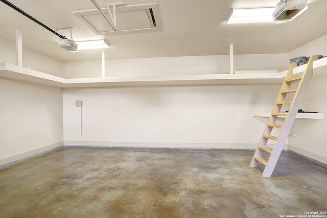 garage with baseboards and a garage door opener