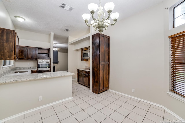 10210 Apricot Fld, San Antonio, TX 78245 - kitchen featuring visible vents, open shelves, an inviting chandelier, dark brown cabinets, and appliances with stainless steel finishes