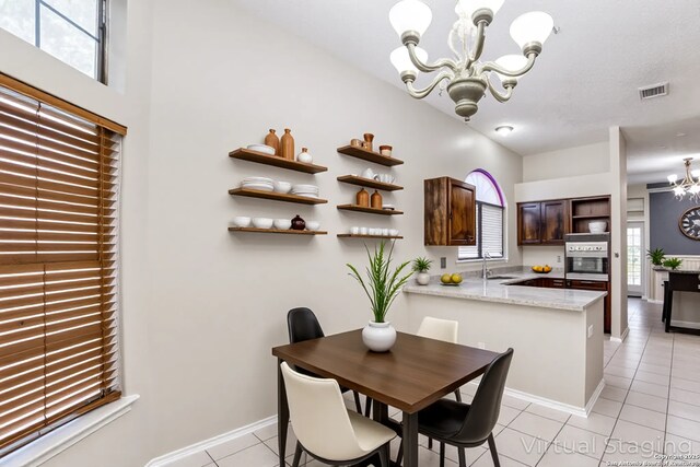 10210 Apricot Fld, San Antonio, TX 78245 - dining room with baseboards, a chandelier, light tile patterned floors, and visible vents