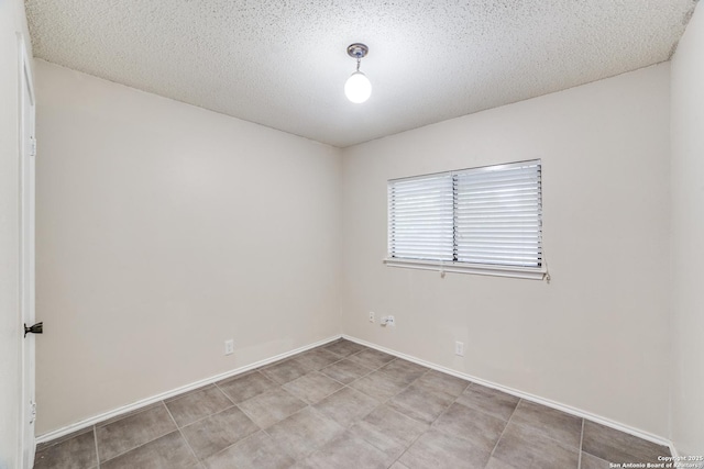 10210 Apricot Fld, San Antonio, TX 78245 - spare room with baseboards and a textured ceiling