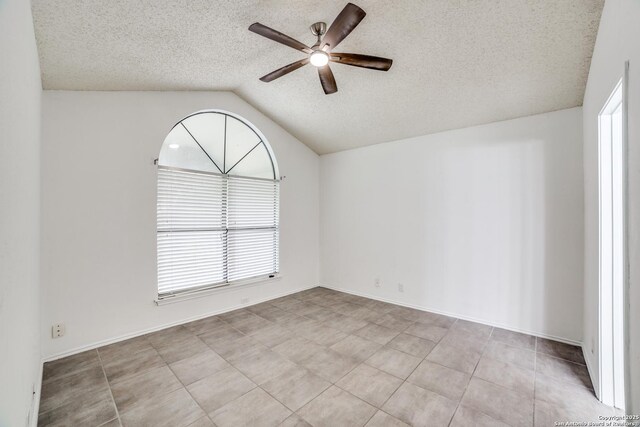 10210 Apricot Fld, San Antonio, TX 78245 - unfurnished room with tile patterned floors, a textured ceiling, ceiling fan, and lofted ceiling