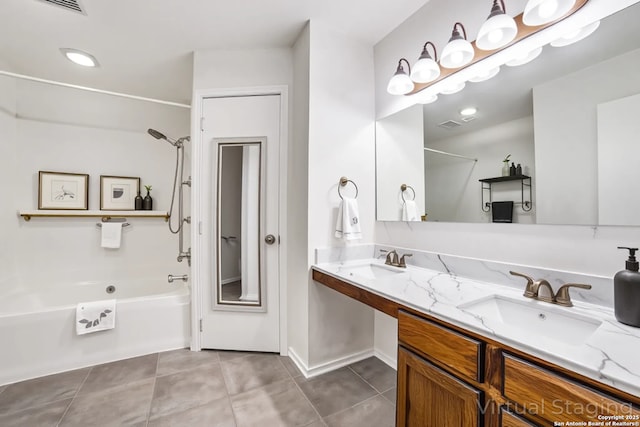 10210 Apricot Fld, San Antonio, TX 78245 - bathroom with double vanity, tile patterned floors, a sink, and shower / bathing tub combination