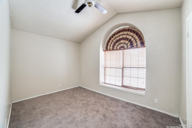10210 Apricot Fld, San Antonio, TX 78245 - spare room with a ceiling fan, a textured ceiling, baseboards, lofted ceiling, and carpet