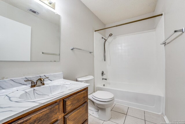10210 Apricot Fld, San Antonio, TX 78245 - bathroom featuring vanity, toilet, a textured ceiling, tile patterned floors, and shower / washtub combination