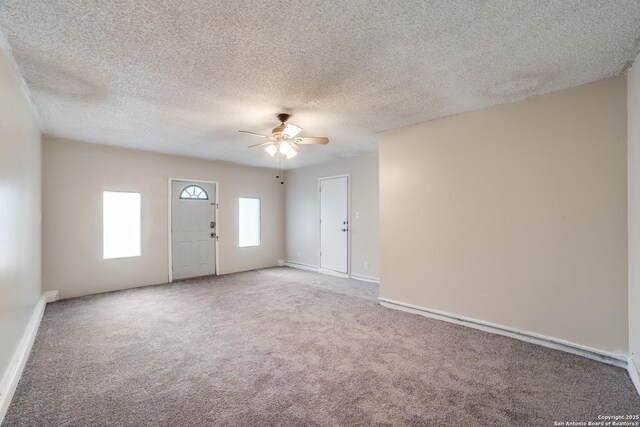 10210 Apricot Fld, San Antonio, TX 78245 - interior space featuring baseboards, a textured ceiling, and ceiling fan