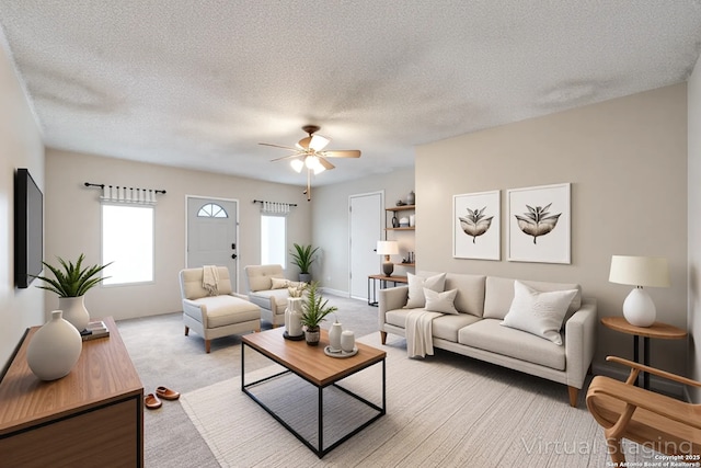 10210 Apricot Fld, San Antonio, TX 78245 - living area with light carpet, a ceiling fan, and a textured ceiling