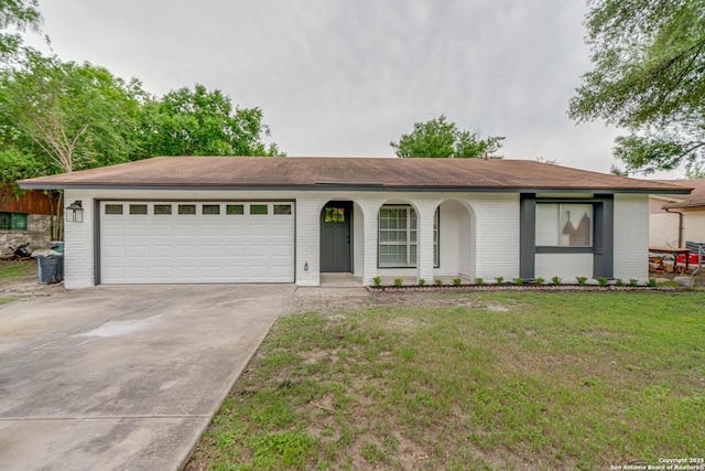 ranch-style house featuring a garage, a front yard, brick siding, concrete driveway, and a porch