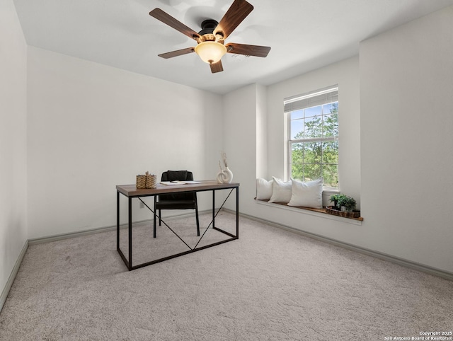office with carpet floors, baseboards, and ceiling fan